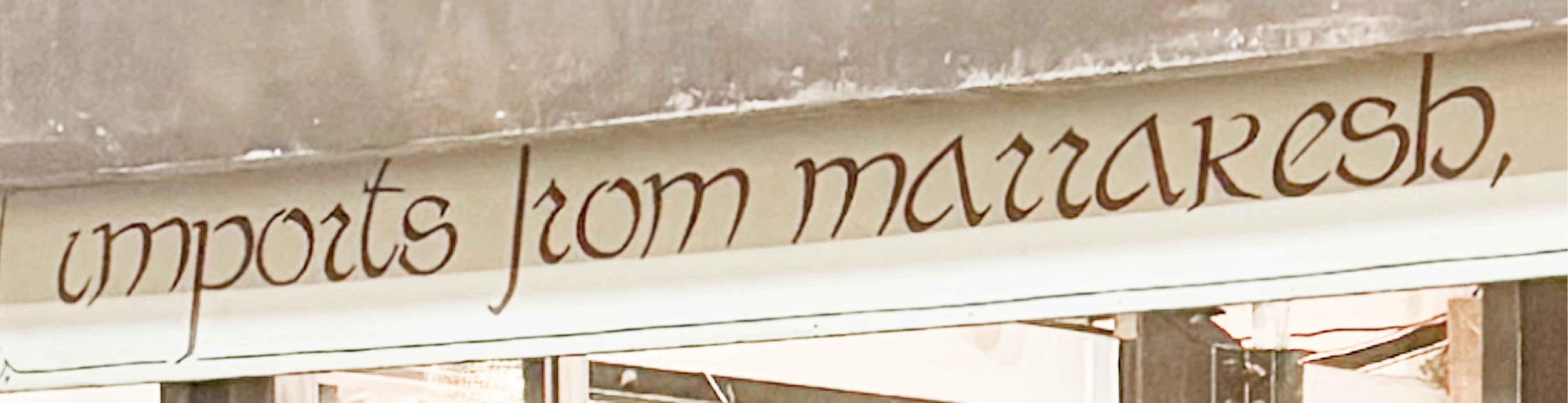 Photo of the hand-painted Imports from Marrakesh awning signage at the Chelsea Market storefront