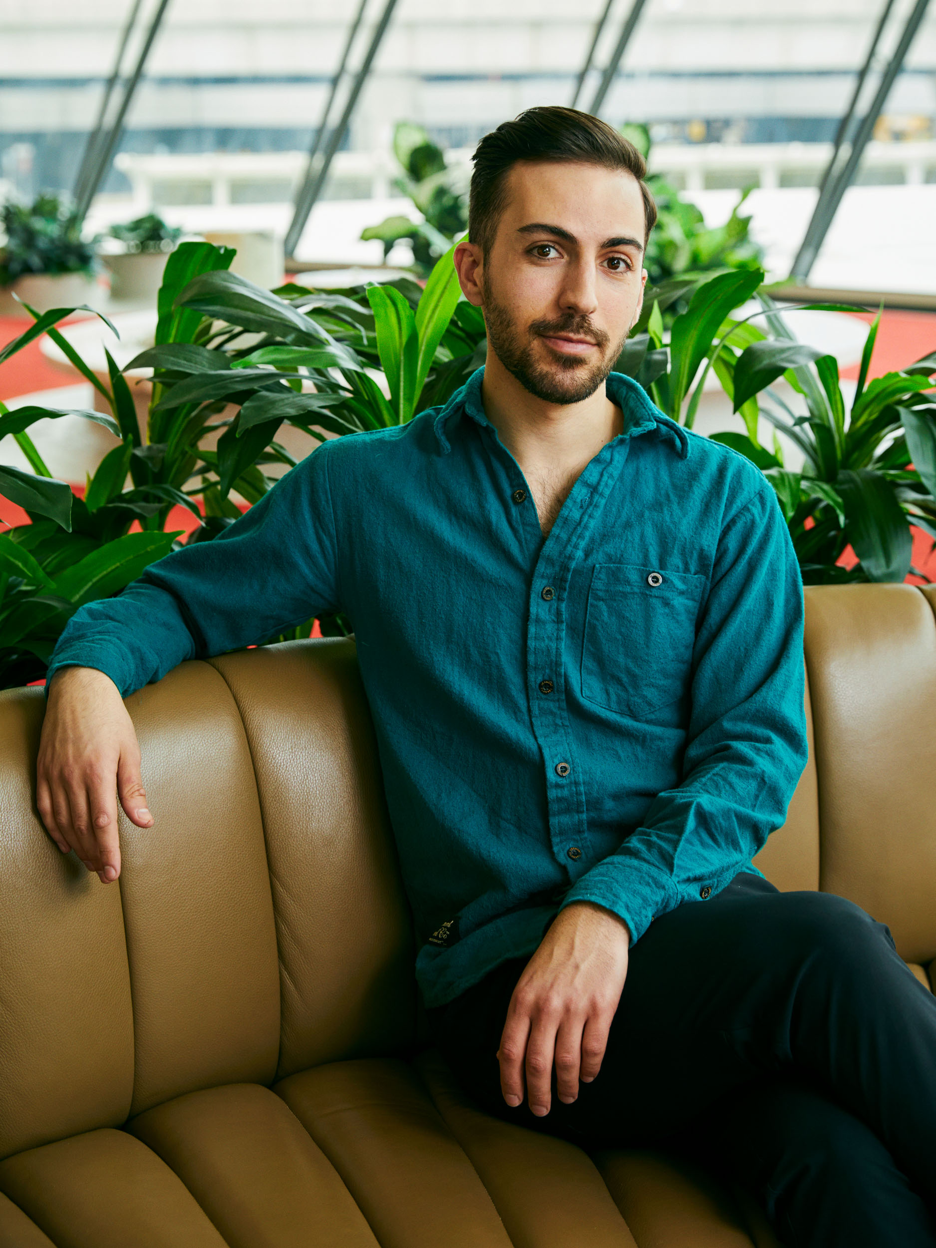 Portrait of David Braha seated at the TWA Hotel