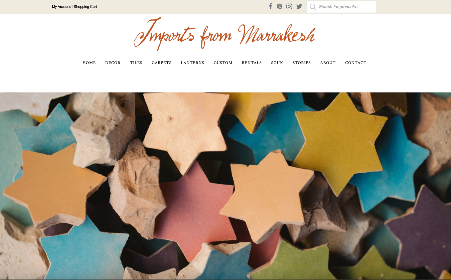 Existing IFM homepage hero: a full-bleed photo of colorful star-shaped tiles with no visible product names, prices, or descriptions