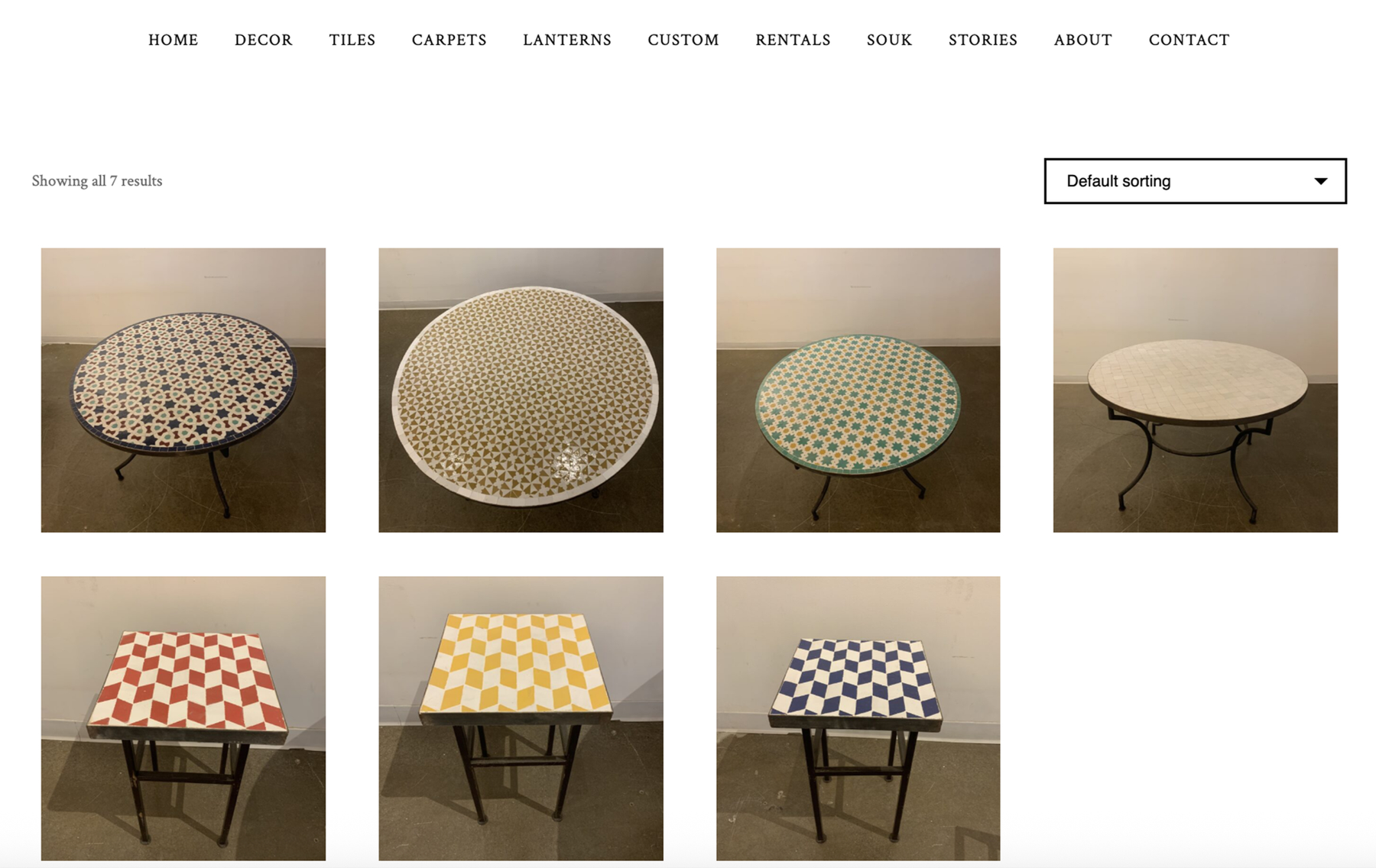 Existing IFM product listing page showing mosaic tables photographed at inconsistent angles and backgrounds, with no names or prices shown